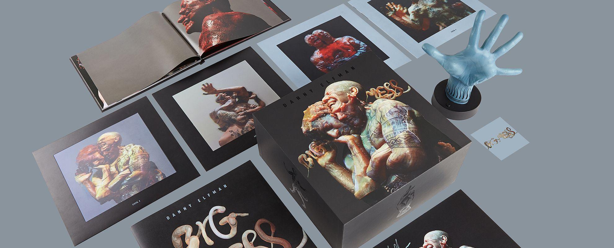 A record cover and inserts spread across an abstract space