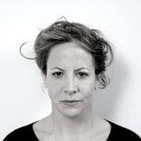 Black and white headshot of a woman with light hair